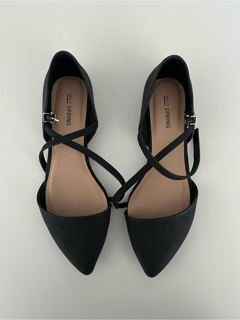 Call it Spring crossover pointed toe flats